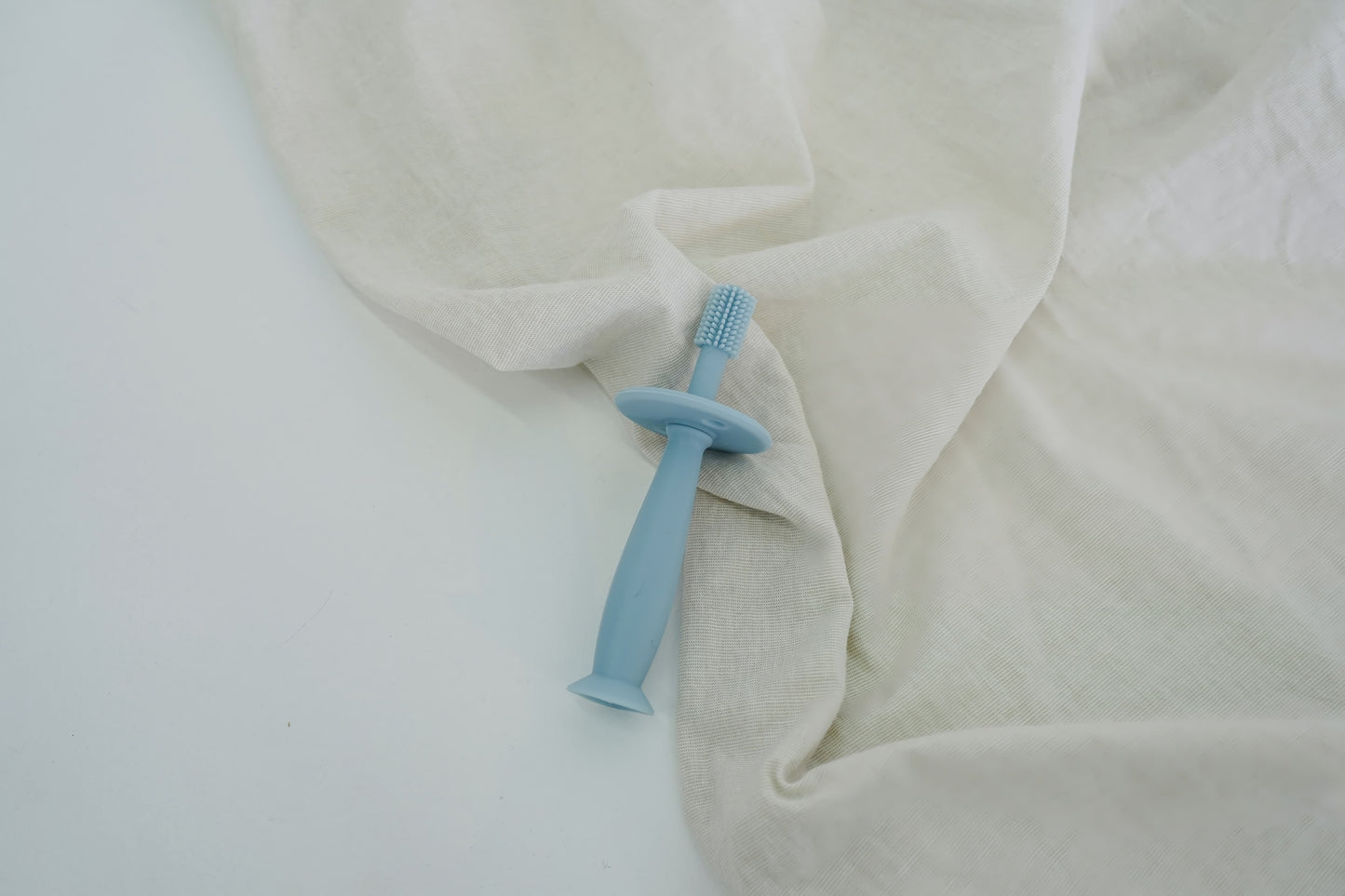 Brosse à dent en silicone bleu pour bébé